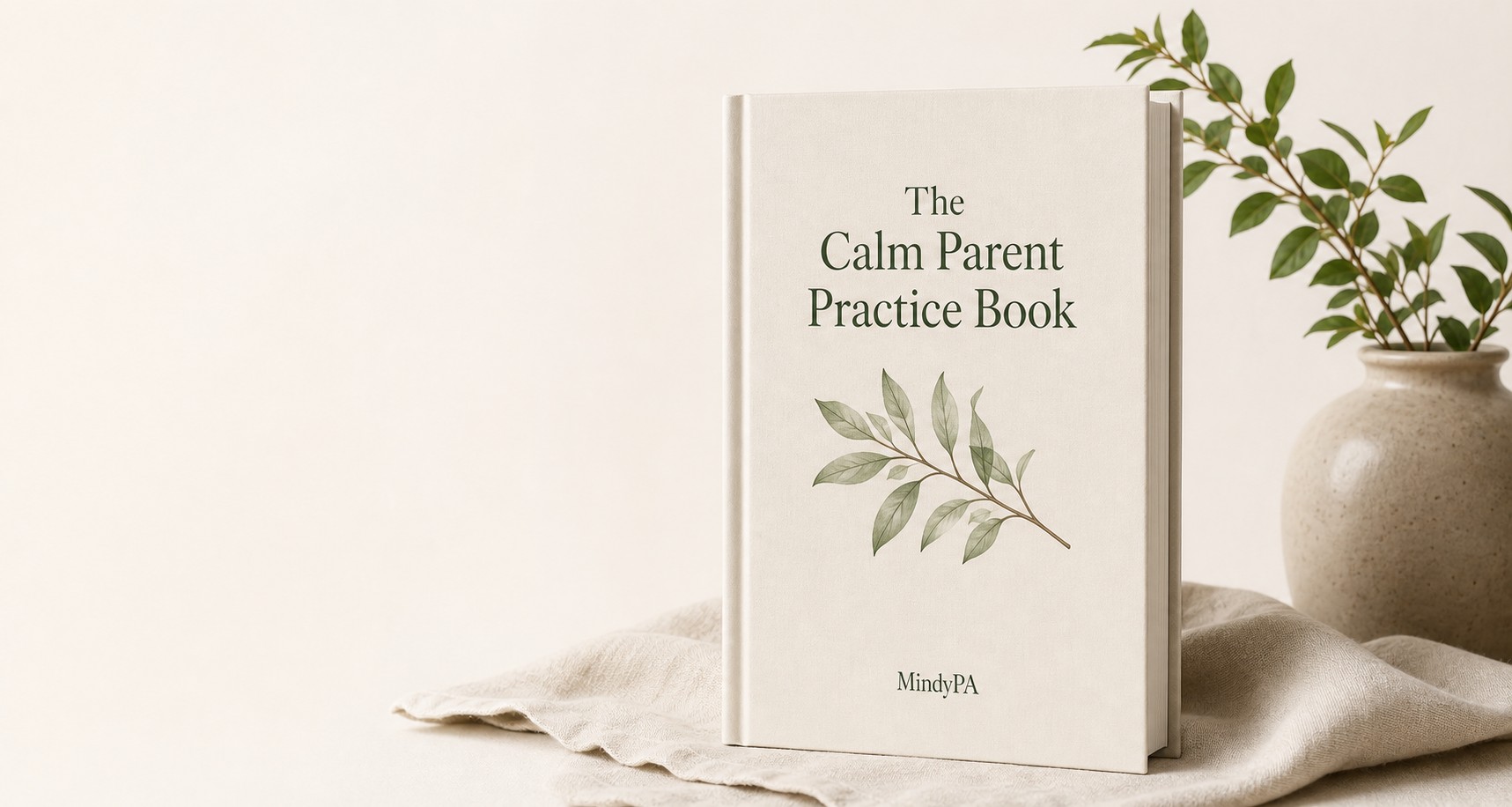 The Calm Parent Practice Book beside a ceramic vase and leafy branch